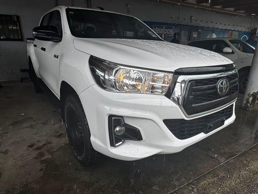 Toyota Hilux 4x4 White with back soft cover