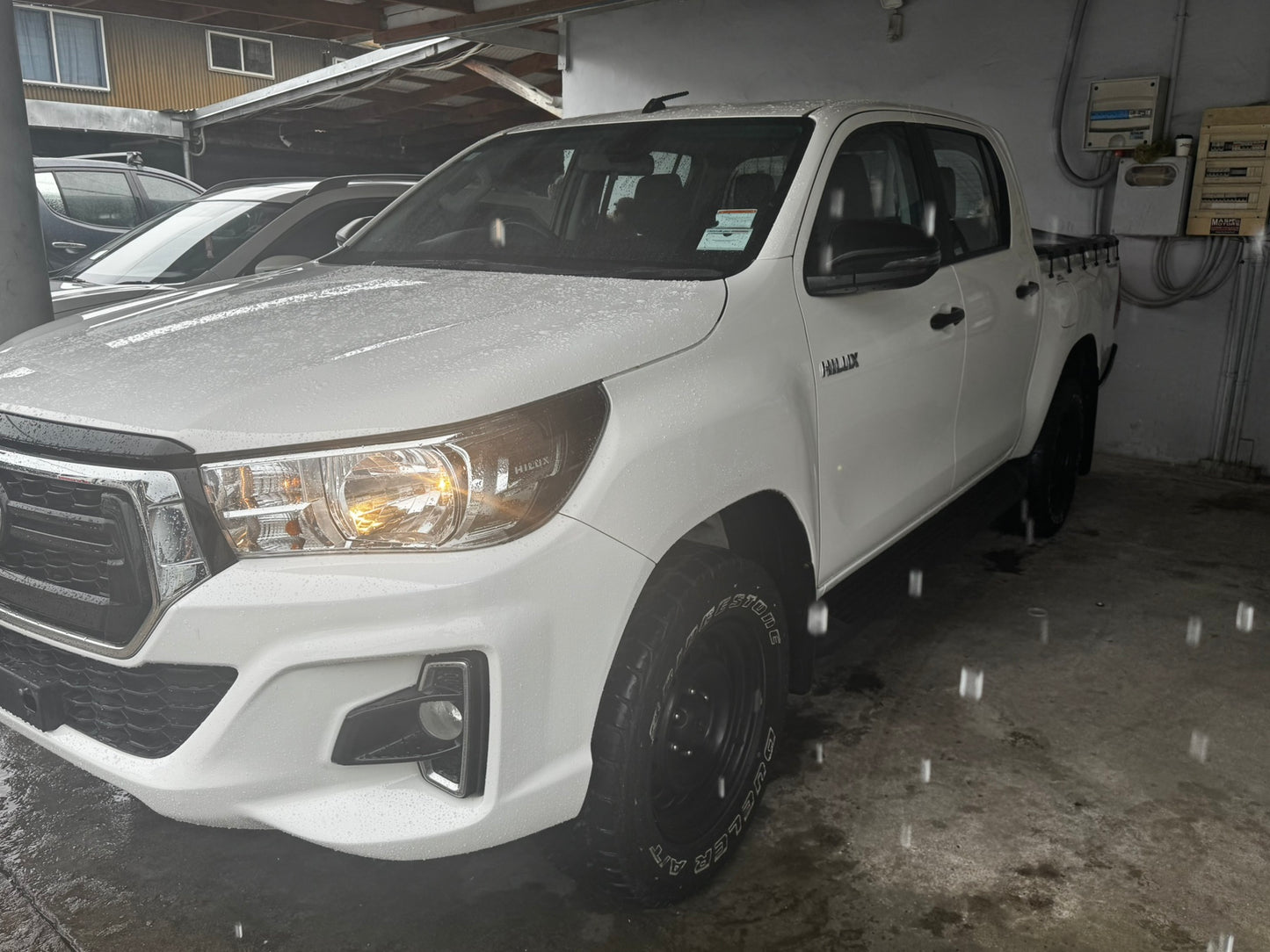 Toyota Hilux 4x4 White with back soft cover