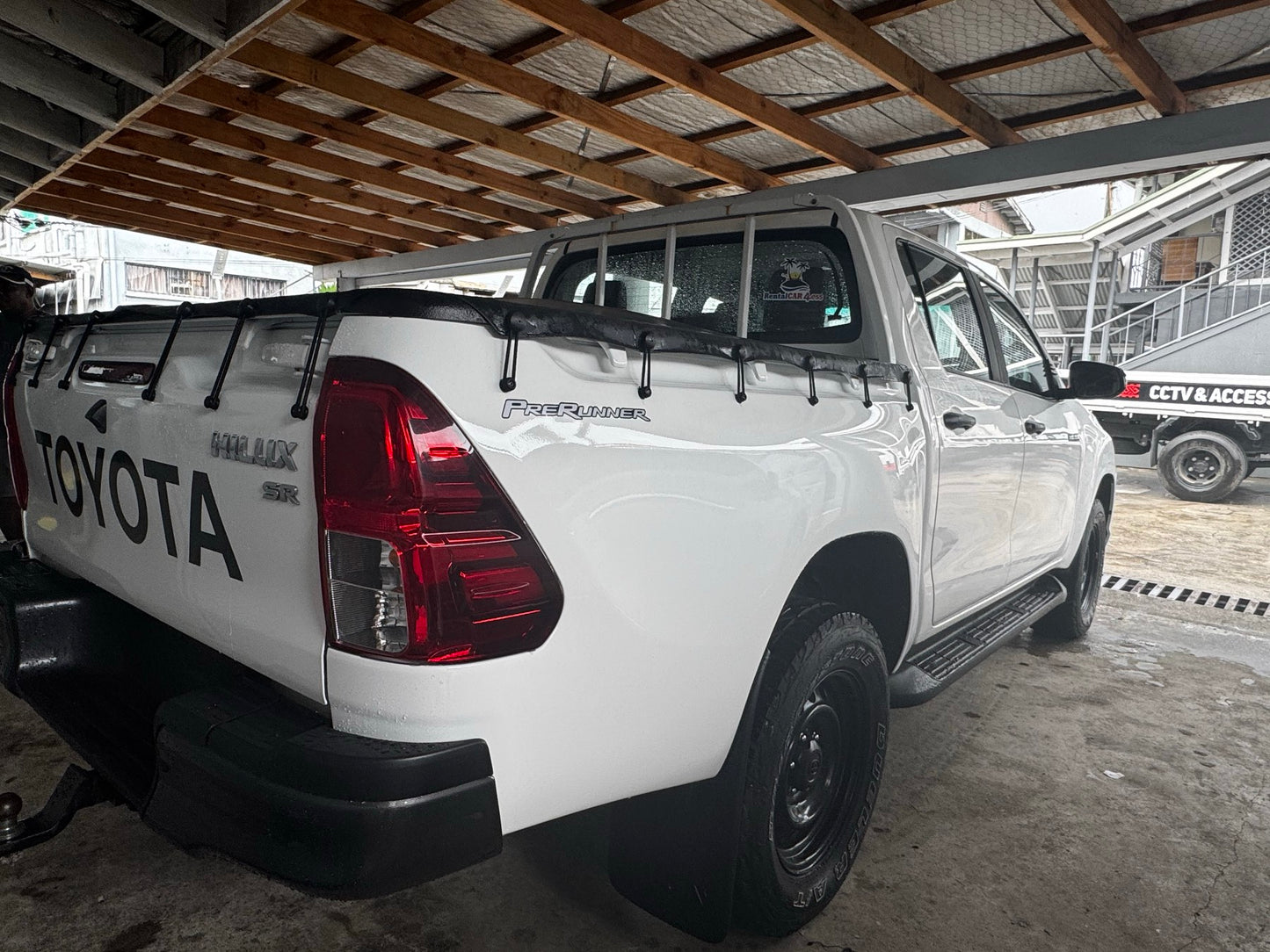 Toyota Hilux 4x4 White with back soft cover